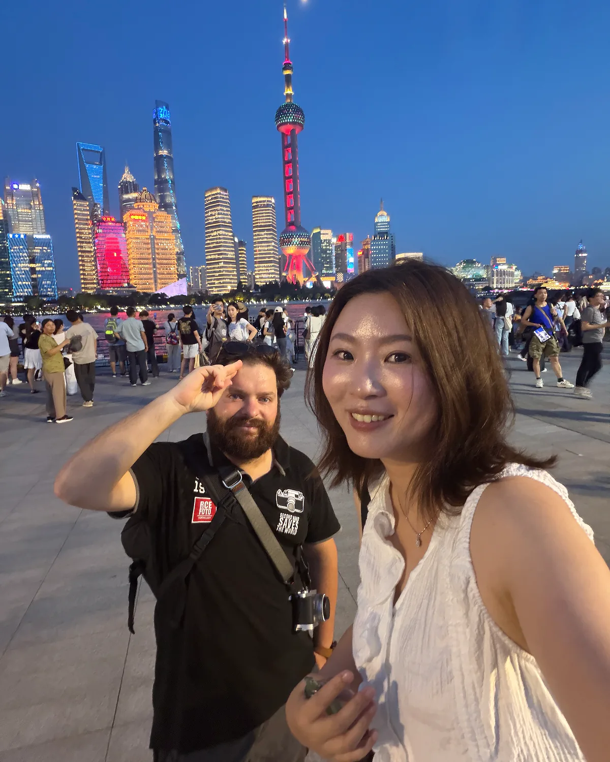 A guest and Local Buddy together by the Shanghai skyline