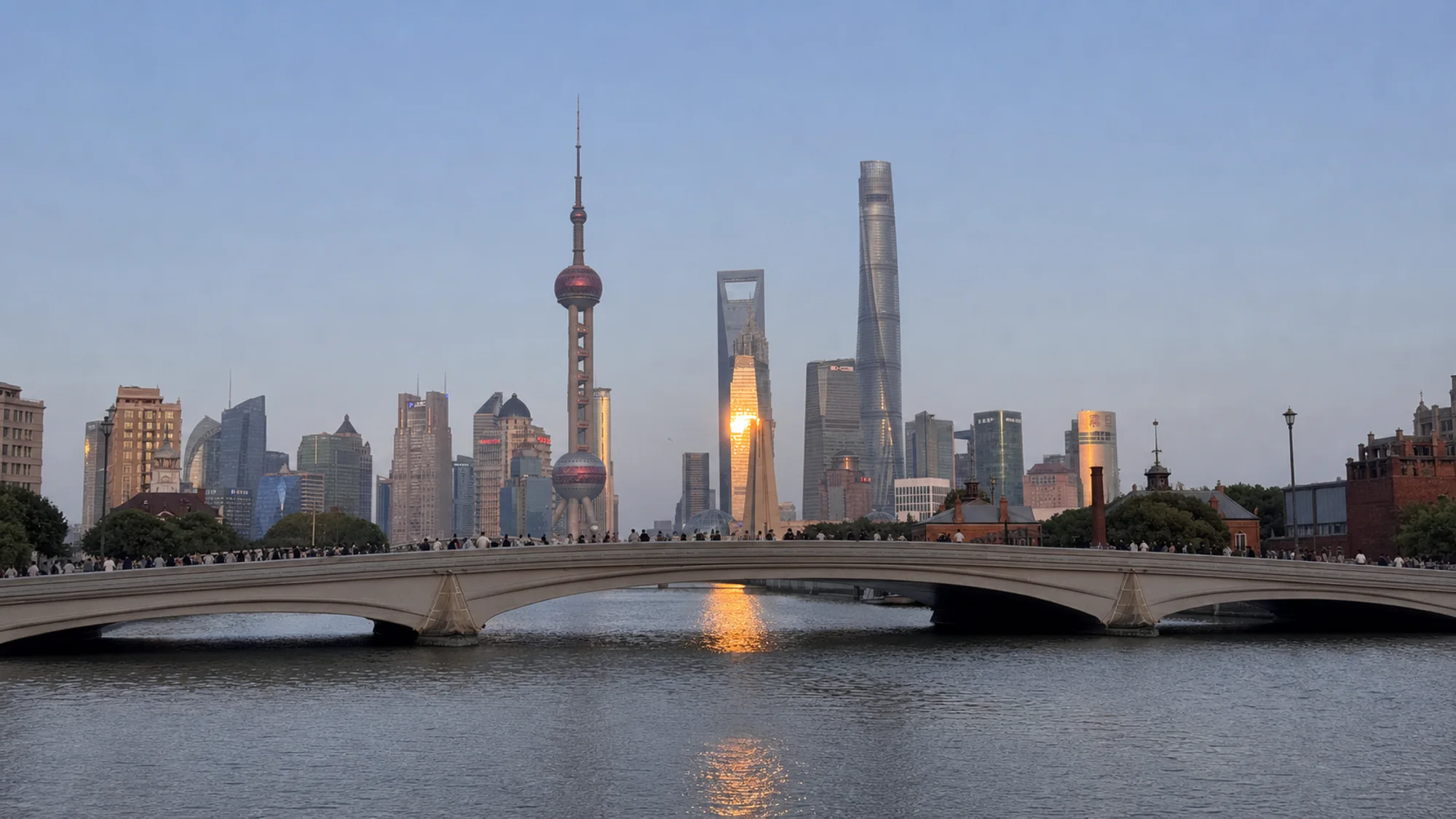 The Lujiazui skyline beyond a bridge across Suzhou Creek in Shanghai.